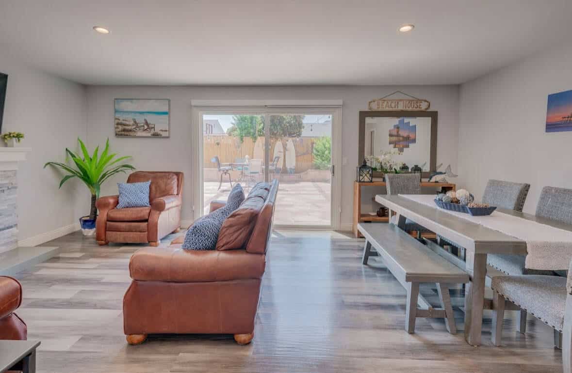 Open living and dining space with sliding doors to the patio