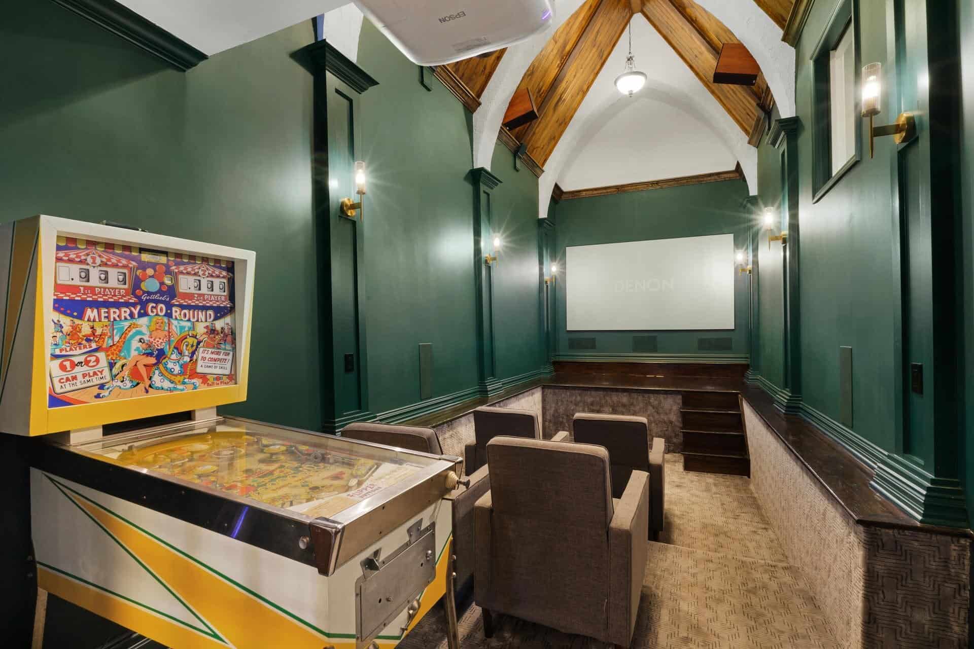 Media and recreation room with vaulted wood ceiling
